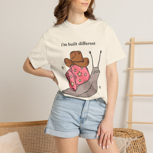 Snail Graphic T-Shirt — "i'm built different like incorrectly i think" Cute Cowpoke Shell Tee